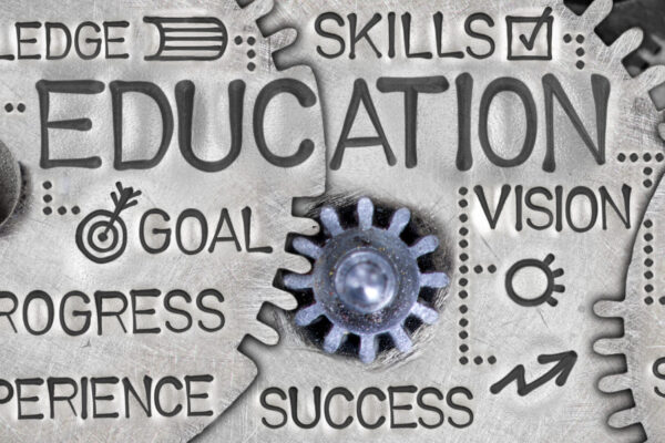 Macro,Photo,Of,Tooth,Wheels,With,Education,Concept,Related,Words